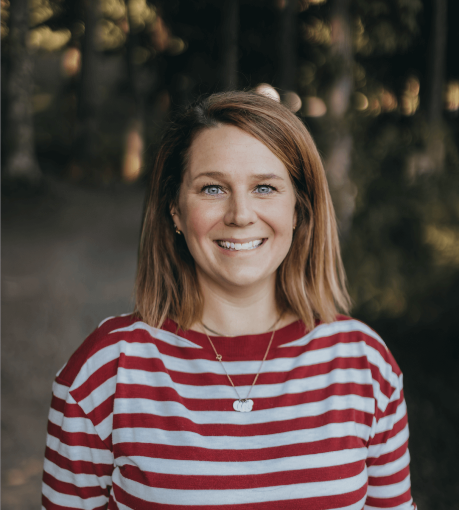 white woman with brown hair has a red and white striped shirt on